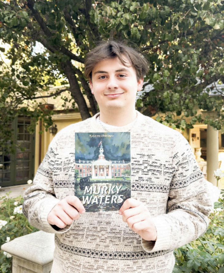 VIDALAKIS PROUDLY DISPLAYS his new book